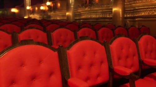 Elegant Empty Red Velvet Seats in a Grand Theater Hall