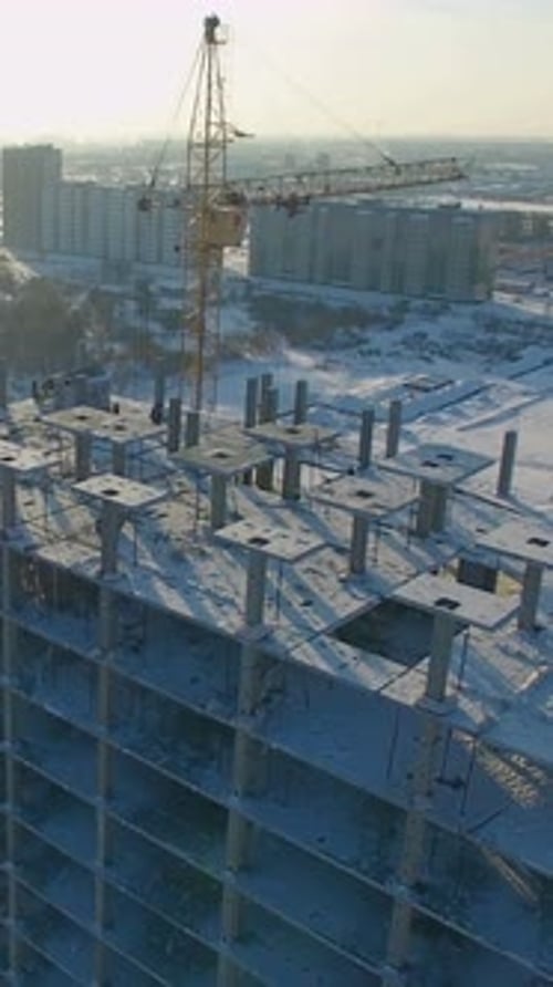Construction Progress of Highrise Building in Snowy Environment During Daylight Hours
