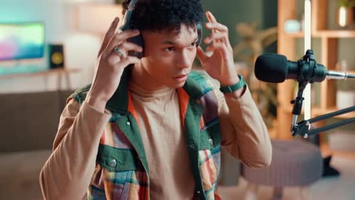 Podcast, microphone and headphones with man in studio for content creator, streamer or broadcast