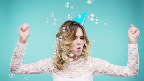 Happy, dance and party woman with crazy energy dancing and bubbles with music