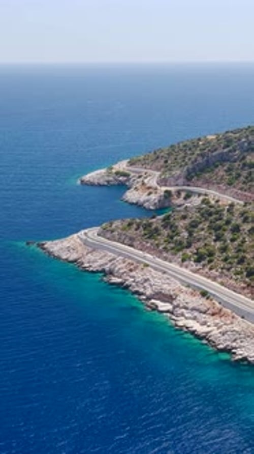 Aerial View of Coastal Road near Azure Sea