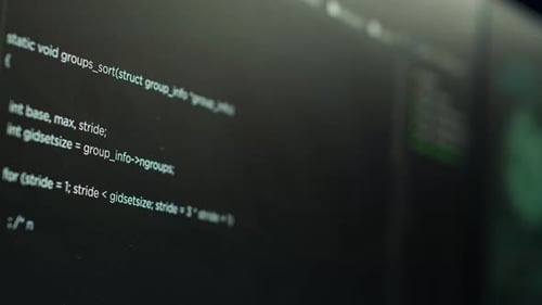 Extreme Close Up Shot of Lines of Code Displayed on Computer Monitors