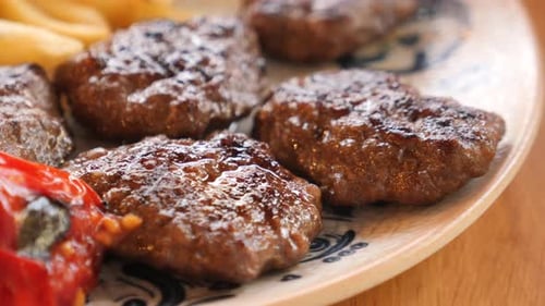 Meatballs, Fries, and Tomatoes Close Up