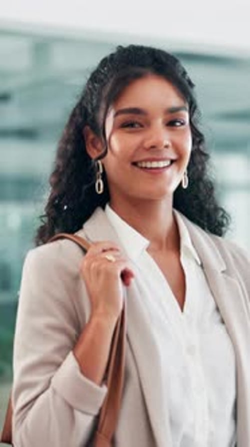 Face, smile and walking with business woman in lobby of office for start of career or job