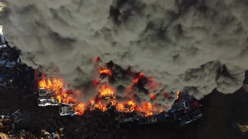 Fire Huge Fire at a Car Junkyard Black Smoke Pollutes the Atmosphere Ecological Disaster Global