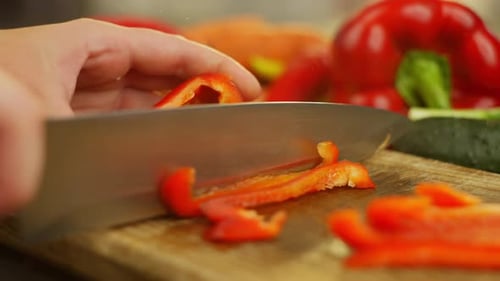Cutting Red Pepper on a Cutting Board