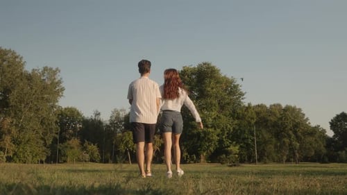 Couple Walking In The Park