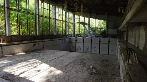 Eerie silence surrounds the abandoned swimming pool of Prypiat since the Chernobyl Reactor meltdown