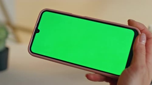 Woman Holds Chroma Key Phone with Finger Tap