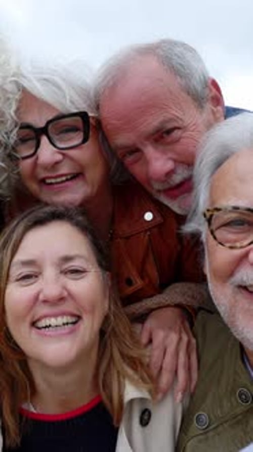 Portrait of Happy Diverse Senior Friends Standing Together at City