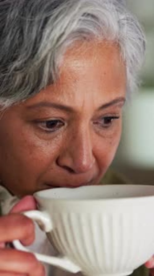 Coffee, thinking and relax with business woman in office for reflection, calm and herbal drink