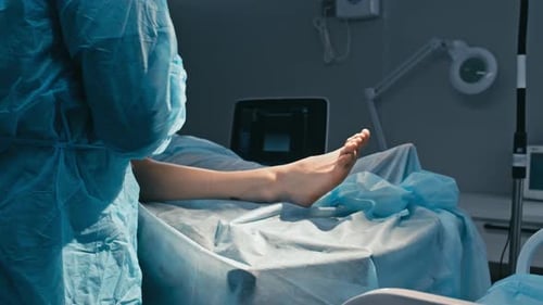 Surgeon Performing Foot Surgery in Hospital Operating Room