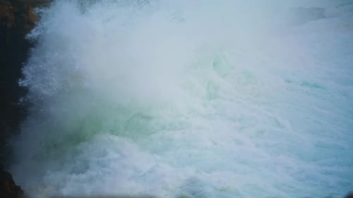 Violent Ocean Waves Crashing Wild Cliff Closeup. Seashore Storm Crashing Rocks Coastline