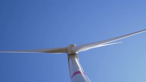 SLOWMO - Detail of rotating wind mill turbine - from bottom
