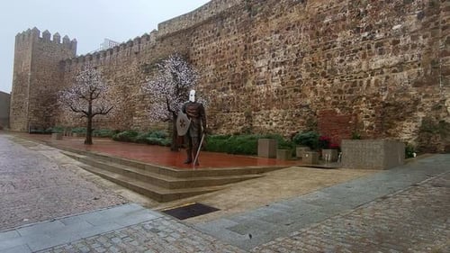 Templar fortress of Jerez de los Caballeros, Spain. Walls of a Templar castle and a medieval knight