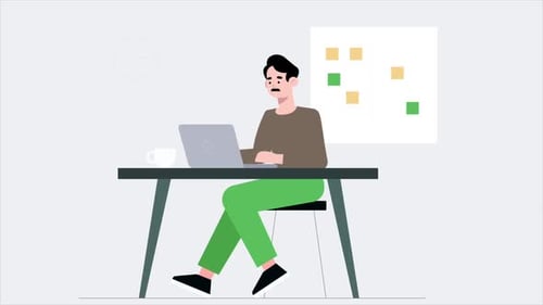 A Mustachioed Male Employee Working In The Office Is Working On A Project On His Laptop