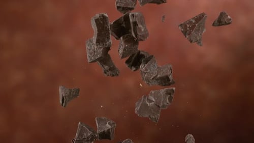Chunks of Dark Chocolate Falling in Slow Motion