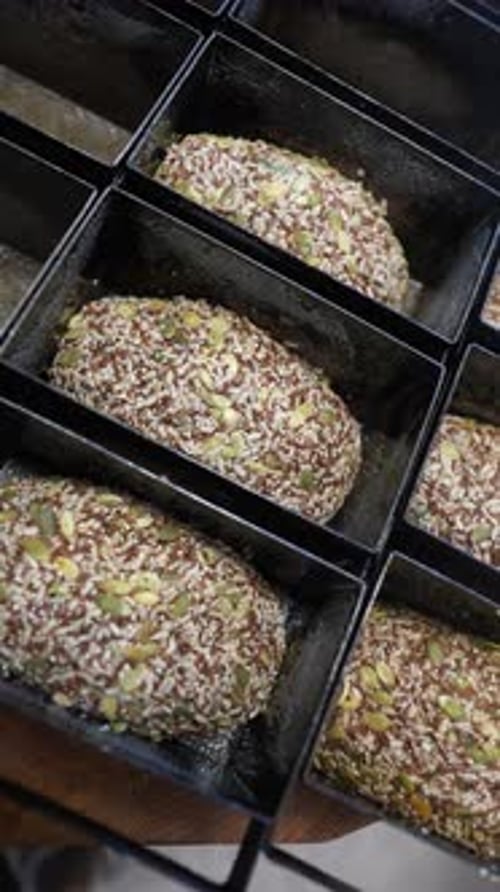 Unbaked Seeded Bread Dough in Loaf Pans