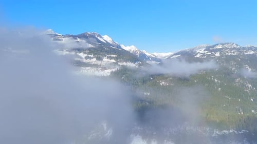 Aerial View on Canadian Rocky Mountain Landscape Covered in Snow
