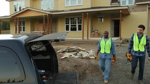 Construction Workers with Tools at Construction Site