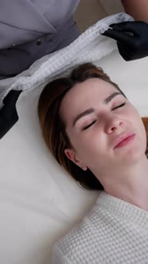 Woman Prepares for Beauty Treatment in Spa