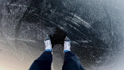 POV of Man Gliding on Frozen Lake Then Slowing to Stop - Winter Minimalism
