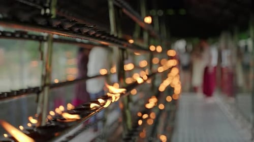 Rows of Oil Lamps Illuminate Sacred Buddhist Temple As Perform Ritual Devotion Spiritual Enhanced By