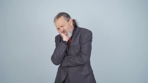 Businessman suffering from toothache.