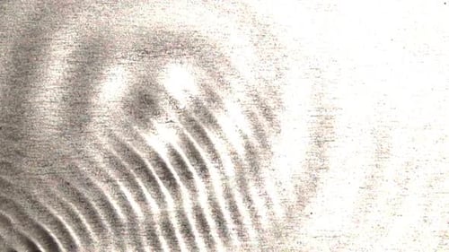 Interference patterns form as two wave patterns intersect and become more complex.