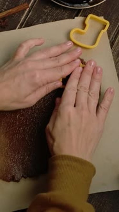 Vertical Video Hands Cutting Out Shapes for Christmas Cookies