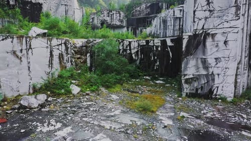 Drone Fly Up Inside Abandoned White Marble Quarry in Carrara Italy