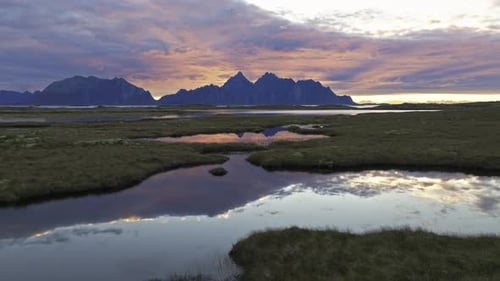 flying up oveer the field of Valberg in Norway during sunrise