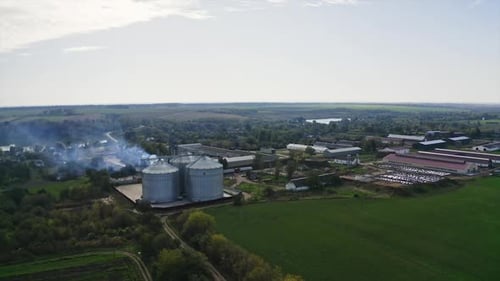 Factory agricultural elevator aerial view. Tanks granary farming elevator.