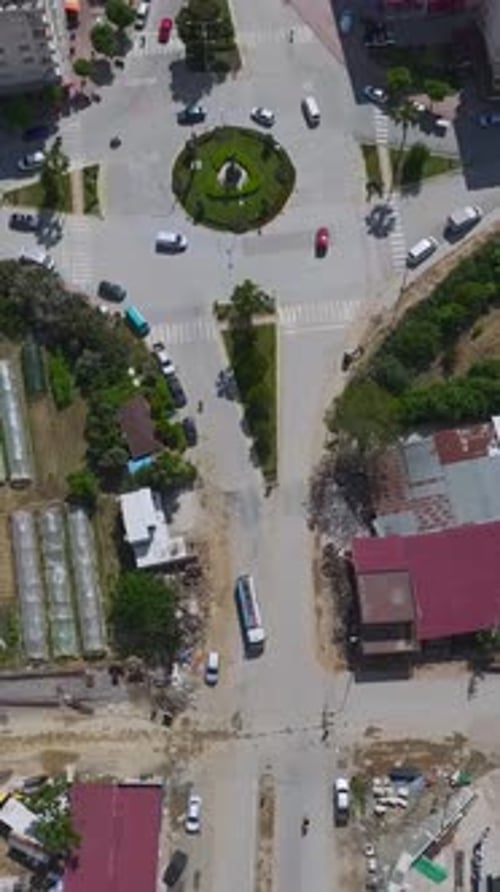 Vertical Video Workers in a Small Coastal Town Handle Construction Tasks Ranging From Concrete