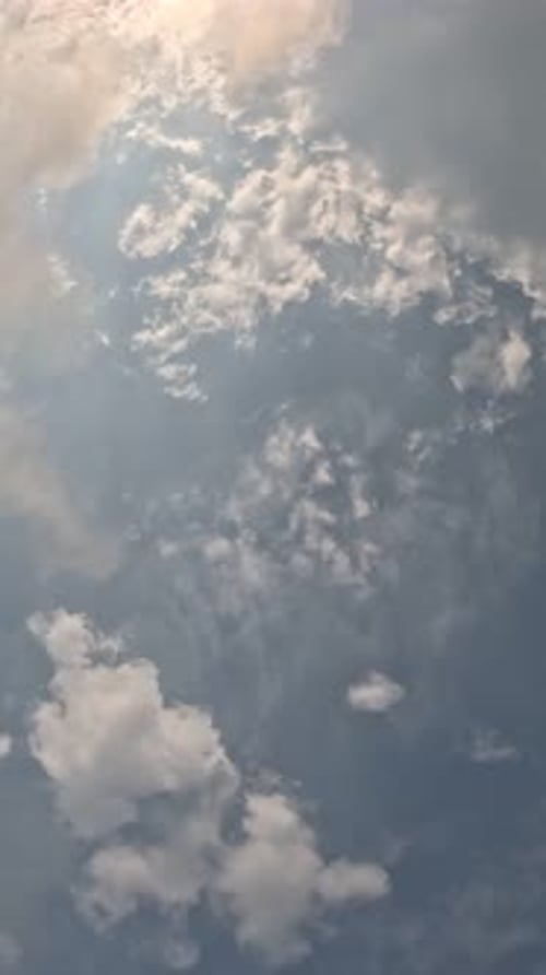 Timelapse Fluffy Cumulus Clouds Moving in Bright Golden Sunset Sky Over Sea Abstract Aerial Nature