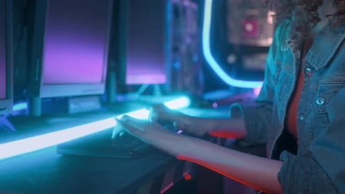 an asian woman programmer is working in her computer room