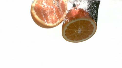 Oranges Splash Into Water,