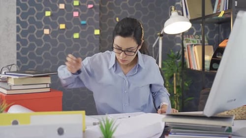 Tired business woman. Business woman working in the office is tired.