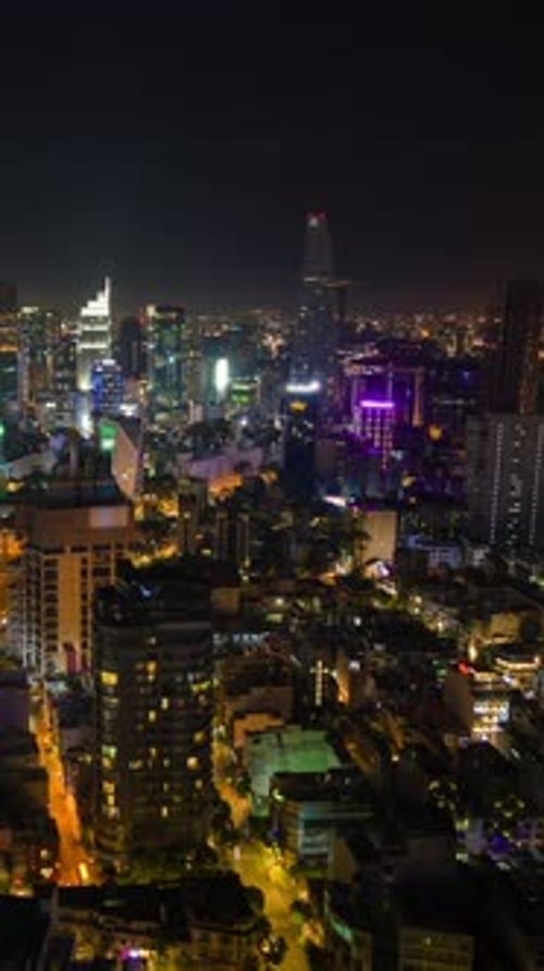 Night Timelapse of Ho Chi Minh City Skyline with Glowing City Lights and Traffic