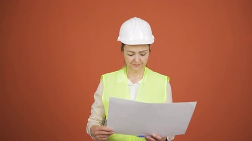 Engineer looking at camera and making positive gesture.