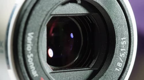 Closeup of Vintage Videocamera Close and Open Lens Zoom of Camera Using Portable Camcorder to