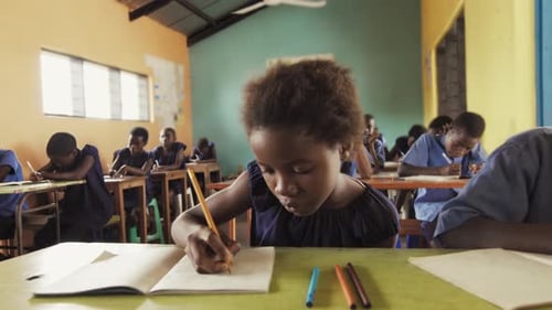 Close View of Pupils in Classroom of African Children Writing English