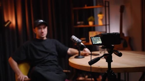 Podcaster Gesturing While Recording Content in Studio