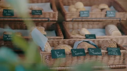 Fresh Bread in Wicker Baskets at Bakery