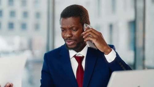 Portrait of Angry Office Worker Talking By Phone with Colleague Black Man Anxious Businessman