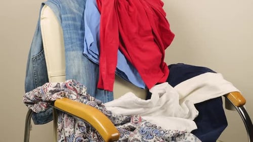 Pile of Clothes on an Office Chair