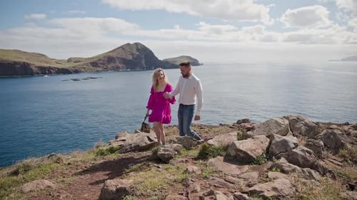 Happy Couple Walking on Cliff Overlooking Ocean in Madeira