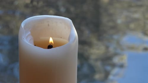 Shot of lighted candles used for prayers in memorial wedding funeral services in a religious church