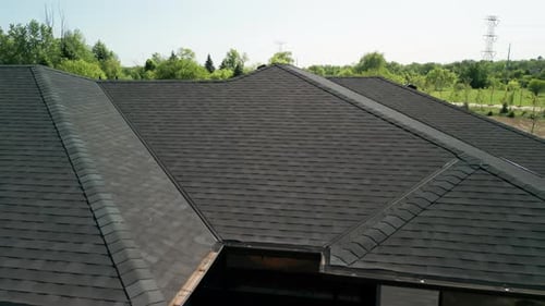 Wide Aerial Shot of New Roof at Sunny Day
