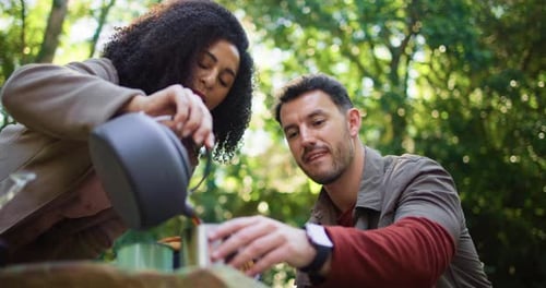 Couple Camping and Enjoying Coffee in Nature